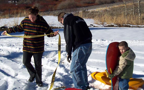 Crookston Cabin - Sarah and Brian and Tyler Getting Ready to Sled