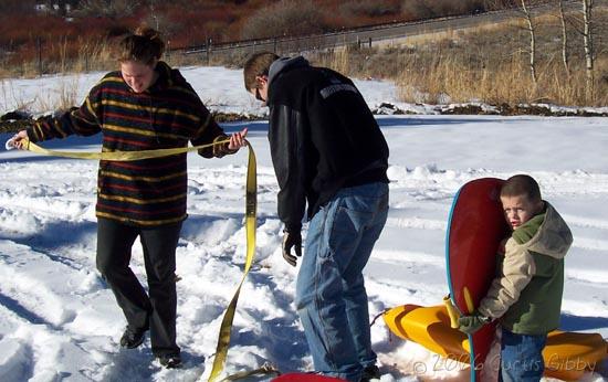 Crookston Cabin - Sarah and Brian and Tyler Getting Ready to Sled