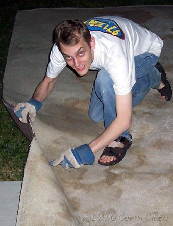 Me cutting up the disgusting old carpet we had in our family room