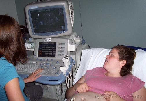 Pregnant Sarah - Sarah and the doctor look at the baby in the ultrasound monitor - second child