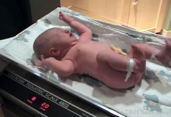 Labor and Delivery - Nathan on the scale (8 pounds 2 ounces)