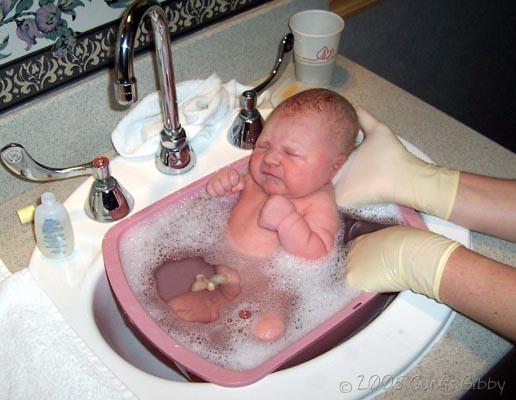 Audrey's first bath in the hospital sink
