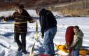View - Crookston Cabin - Sarah and Brian and Tyler Getting Ready to Sled