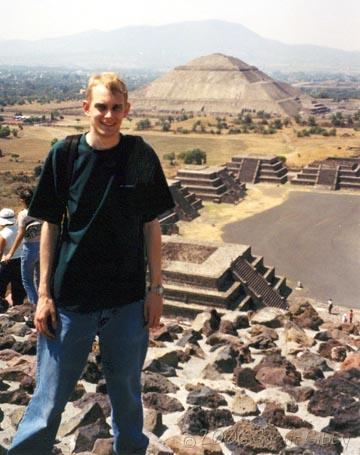 Teotihuacán Mexico - Me standing on the Pyramid of the Moon, with the Pyramid of the Sun in the background
