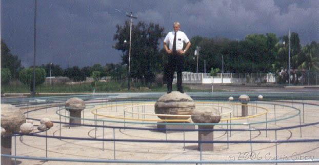 Standing on a model of the solar system in Machiques, Zulia, Venezuela