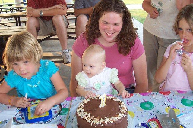 Audrey's First Birthday - Audrey and others with the birthday cake