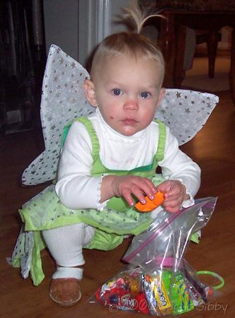 Halloween 2006 - Audrey (in her Tinkerbell costume) with her candy