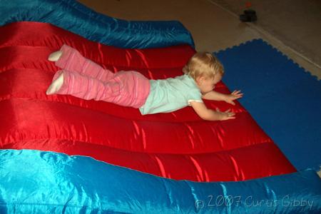 Trip to Wisconsin - Audrey sliding on the bouncy toy