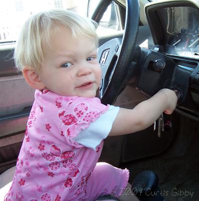 Audrey pretends to drive our Honda