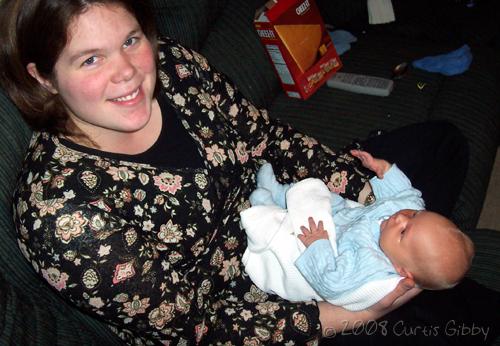 Nathan (15 days old) looks attentively at Sarah