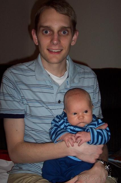 Curtis holds Nathan at 4 weeks