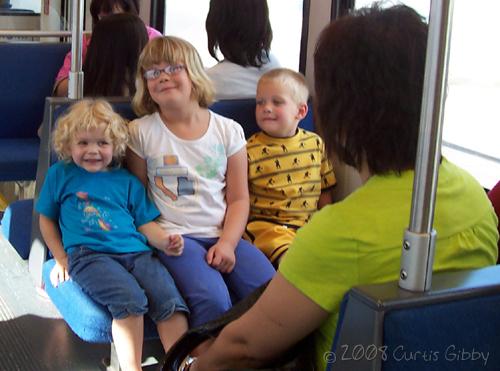 Audrey happily riding Trax with her Durkee cousins
