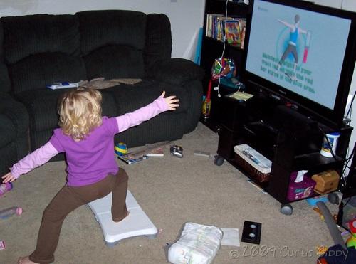 Audrey does yoga with the Wii Fit