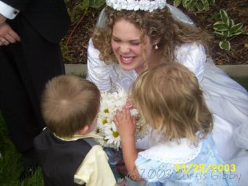 Sarah showing Marilyn and Tyler her flowers