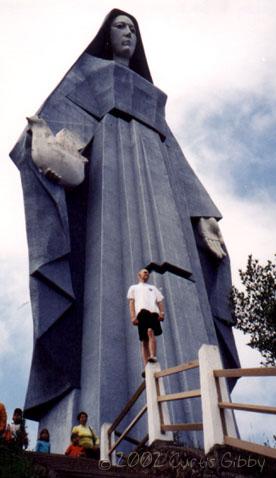 Standing in front of the Virgen de la Paz in Trujillo, Trujillo, Venezuela