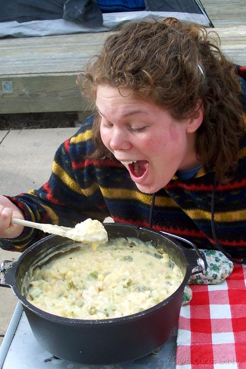 Sarah pretends to eat our dinner straight from the dutch oven
