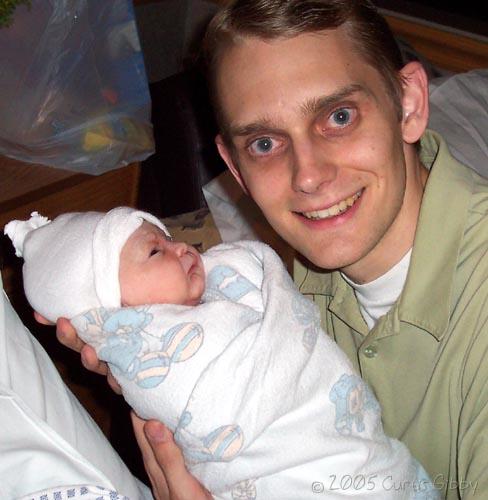 Curtis holds Audrey minutes after she was born