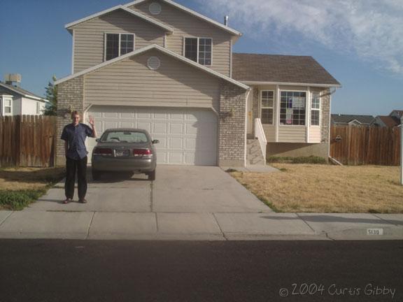 The outside of the house with me standing in front