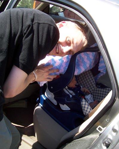 Curtis loads Audrey in the car for her first ride home