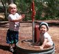 Audrey and Andrew play in a spigot after our hike at Red Cliffs  Campground