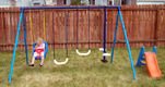 View - Audrey playing on our new swing set