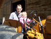 View - Wheeler Farm - Curtis and Audrey drive a tractor